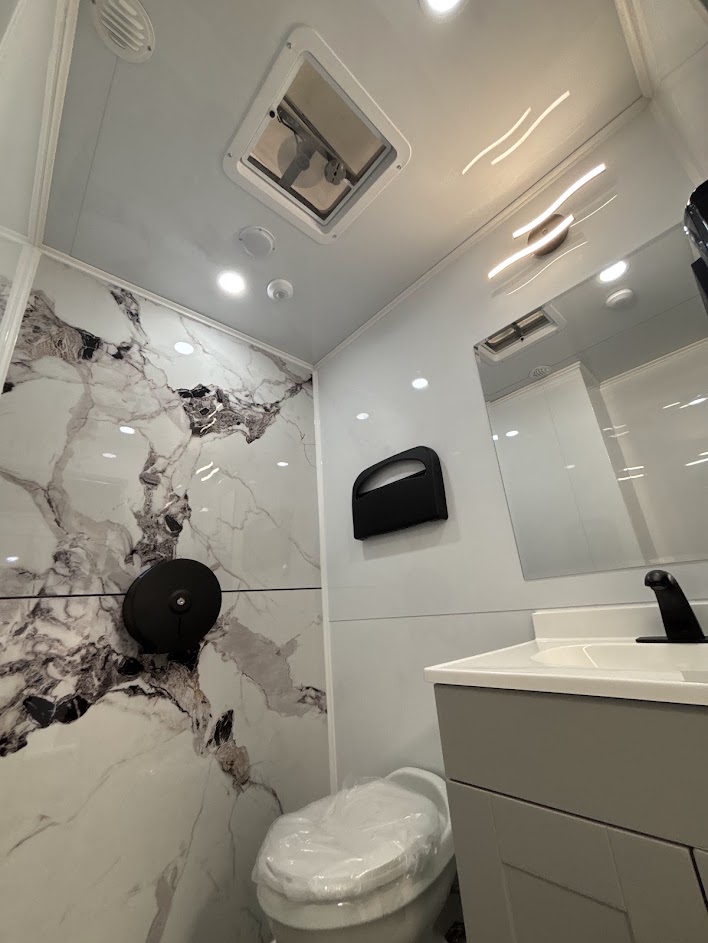 Marble-finished interior of the luxury lavatory suite