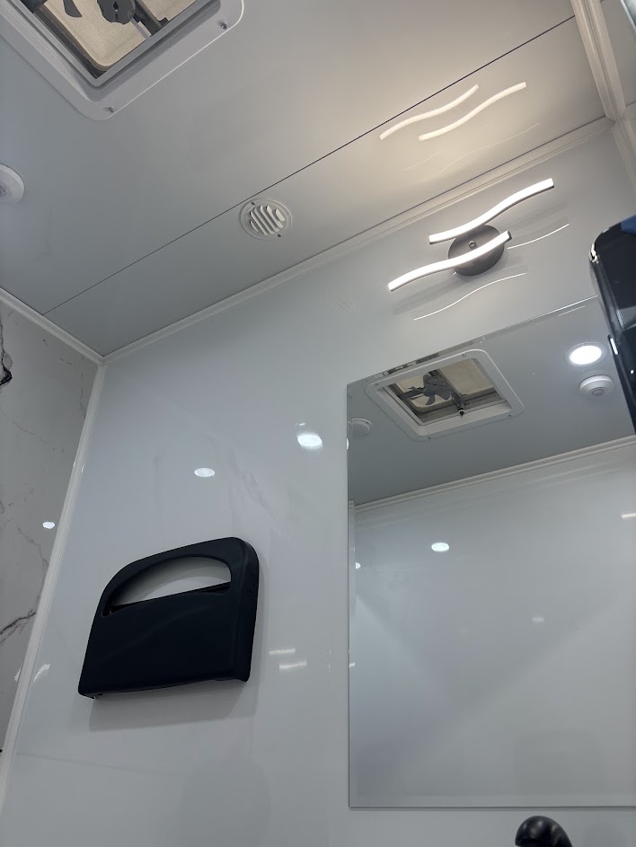 Bright interior stall with mirror and vanity